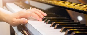 Close up musician hand playing piano